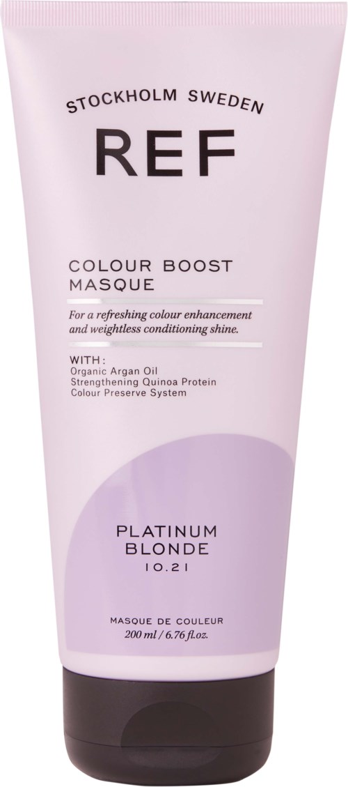 A pink tube of hair mask from REF, labeled 'Colour Boost Masque' for blond hair, with black cap, Swedish origin.