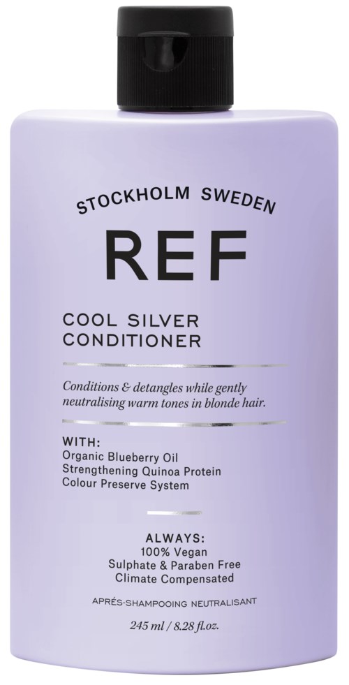 A white bottle with black cap labeled as cool silver conditioner from Stockholm, Sweden, containing blueberry oil and quinoa protein.