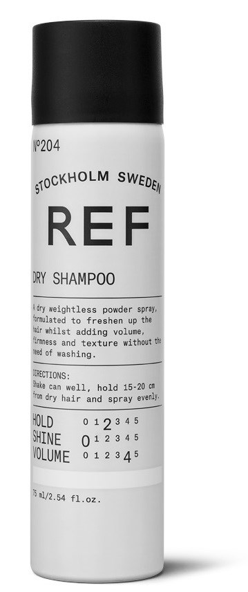 A white bottle with black cap labeled 'REF' for dry shampoo, with instructions and measurement scale.