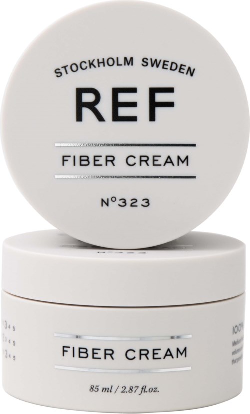 Weiße Behälter mit der Aufschrift 'REF' und 'FIBER CREAM' aus Stockholm, Schweden. Runde, einfache Gestaltung mit schwarzem Text.