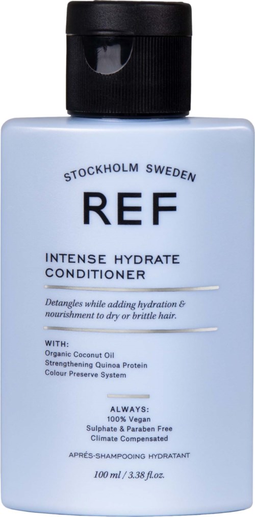 Vaaleansininen pullo, jossa musta kansi, merkinnät REF, tarjoavat intensiivisen kosteuttavan hoitoaineen hiuksille.