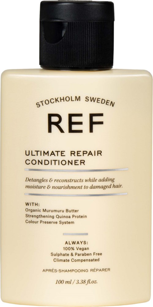 A beige bottle labeled 'REF Ultimate Repair Conditioner' with a black cap, containing hair repair product from Stockholm, Sweden.