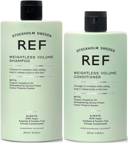 Zwei hellgrüne Flaschen: eine für Shampoo, eine für Conditioner, mit 'REF' Beschriftung und schwarzen Deckeln.