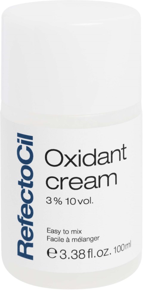 Eine weiße Flasche mit der Aufschrift 'Refectocil Oxidant Cream, 3% 10 vol., leicht zu mischen,' in blauer und schwarzer Schrift.