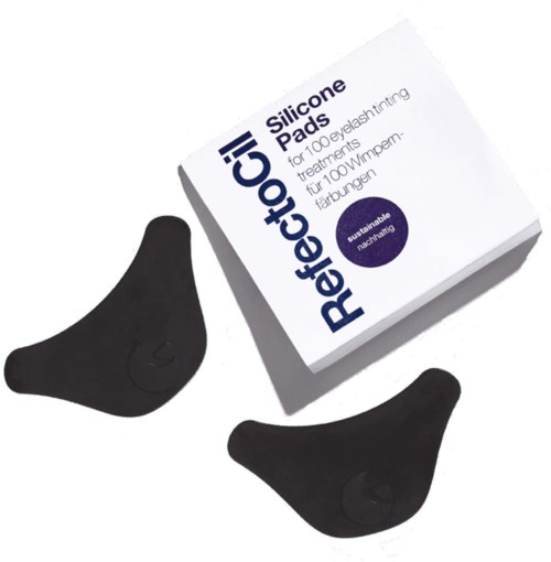 Twee zwarte siliconen pads en een doos met 'ReflectoCil' voor het kleuren van wimpers.