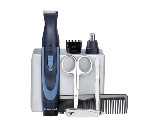 A grooming kit with an electric trimmer, scissors, a small bottle, a comb, and a white storage tray.