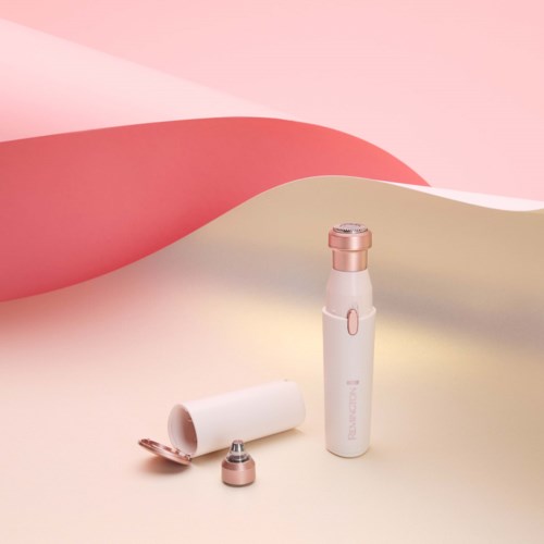 A small, white and pink beauty device with a detachable head, set against a pink and cream background.