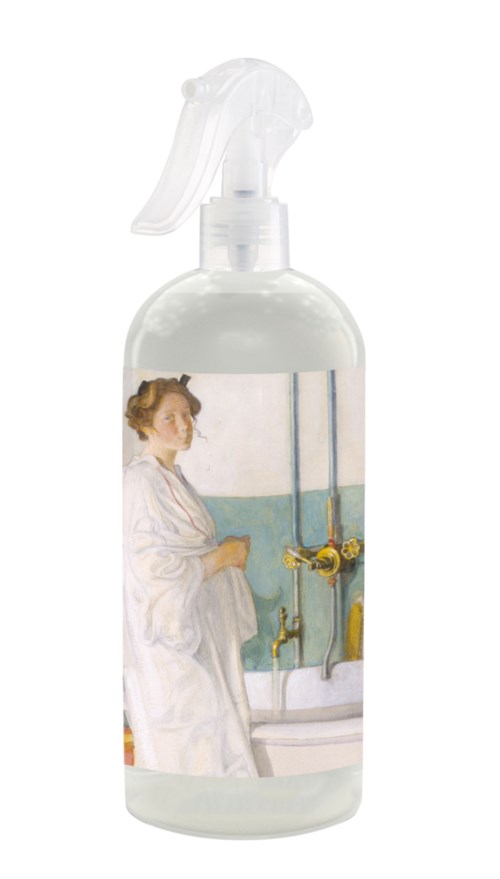 A woman in a white coat stands next to a sink with a faucet and two sink plugs.