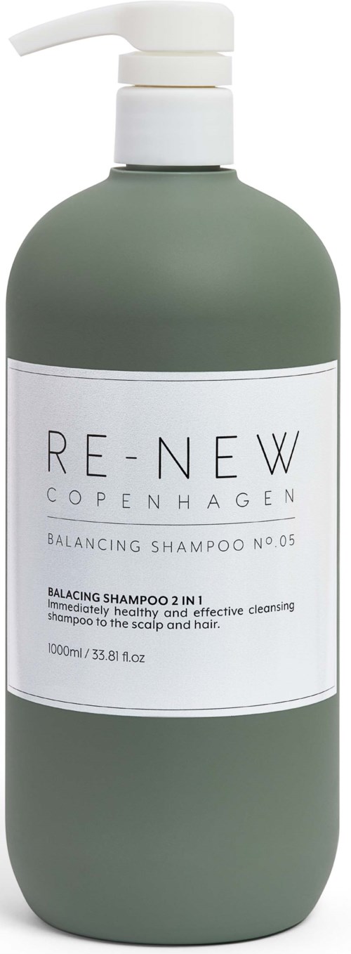 A green bottle with a white label showing 'RE-NEW COPENHAGEN' and 'Balancing Shampoo.' It has a white pump.