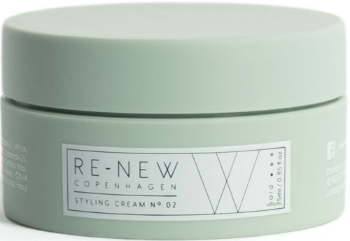 Ein runder, hellgrüner Behälter mit Aufkleber, verwendet für Styling-Creme, genannt Re-New Copenhagen.