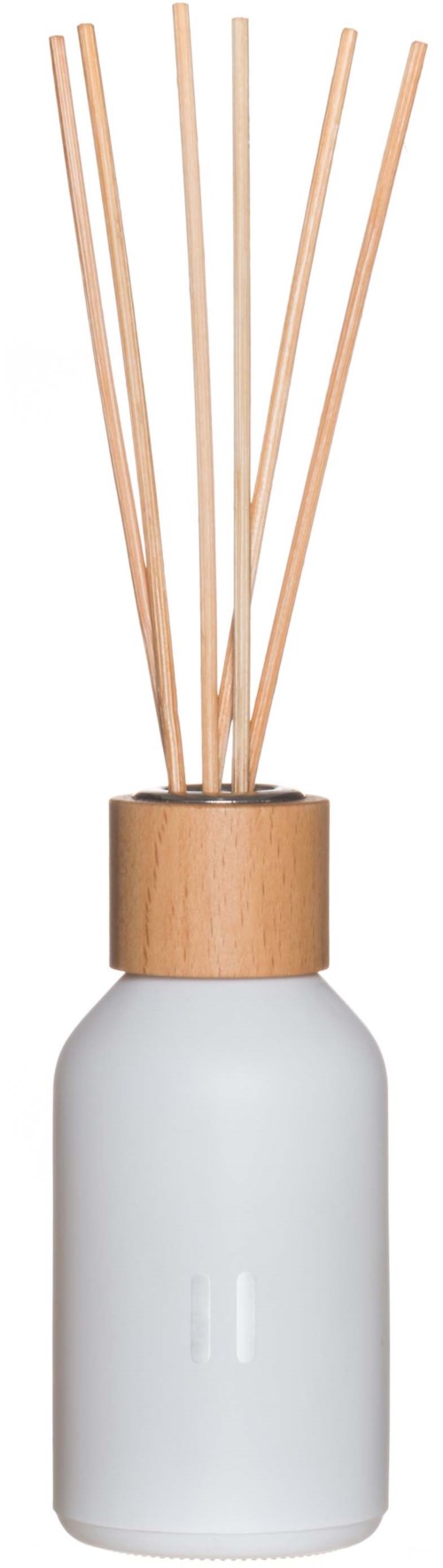 A white bottle with a wooden top holds several sticks, likely used as a diffuser for scent.