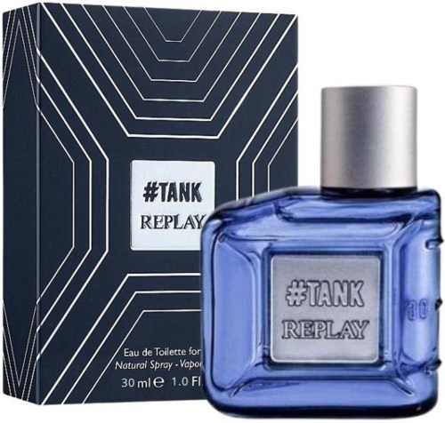 A blue perfume bottle with a silver cap and a geometric design box behind it.
