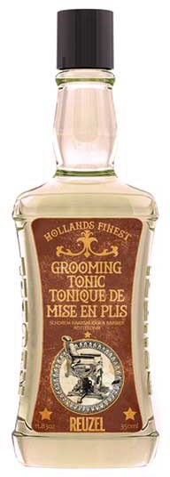 A glass bottle of grooming tonic with a brown label, gold details, and a black cap.