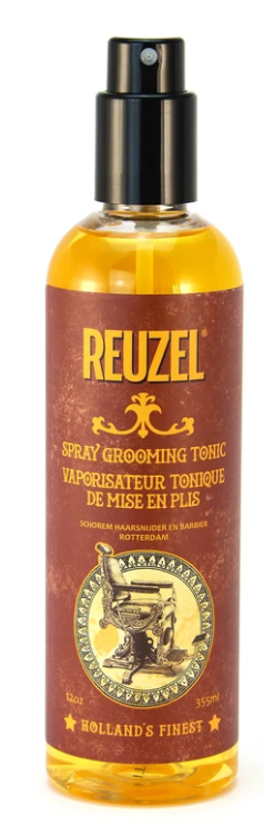 A small spray bottle with yellow liquid, labeled Reuzel, used for grooming or freshening up.