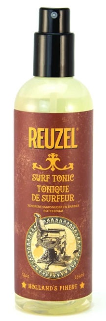 A spray bottle labeled Reuzel Surf Tonic with a black pump and yellowish liquid inside.