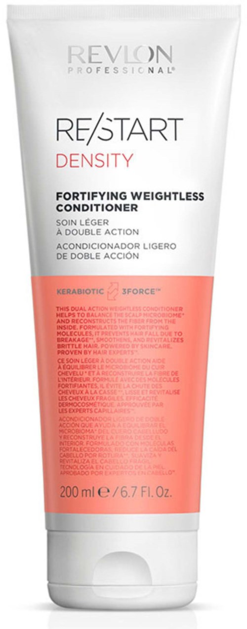 Eine weiße Tube von Revlon Spülung mit roten Akzenten, gekennzeichnet für kräftiges Haar. Enthält 200 ml.