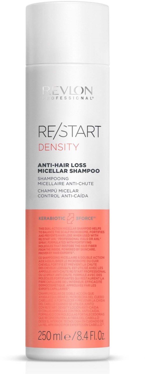 Witte fles Revlon Professional anti-haaruitvalshampoo met rood label en zwarte tekst, 250 ml.
