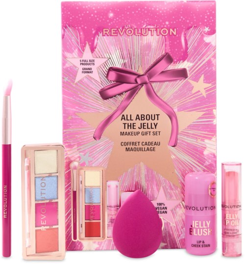 Pinkes Verpackungsset mit Make-up-Produkten, ein Schwamm und Lip Balm, verziert mit Sternen und Schleife.