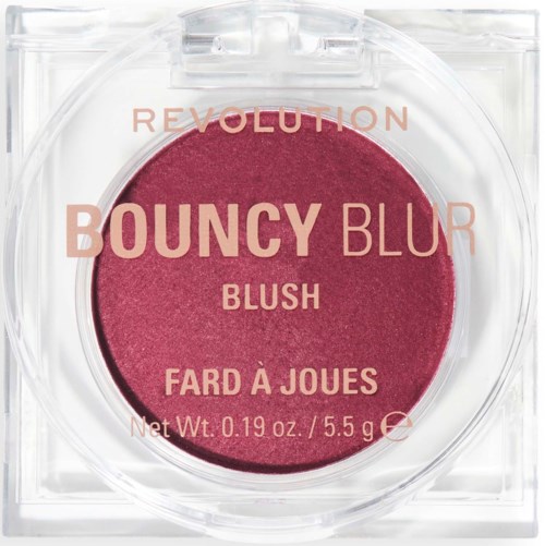 A round makeup blush in a clear case with pink-colored product and text on the surface.