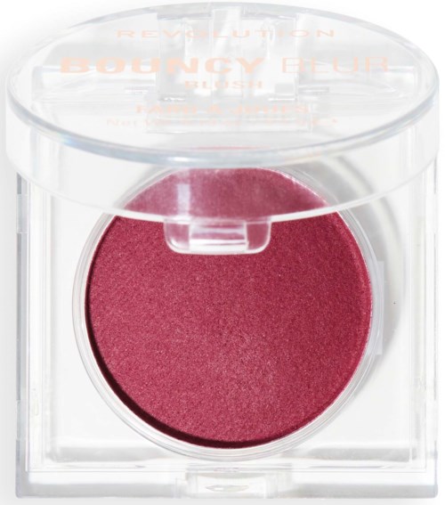 A round pink blush in a clear plastic container with a transparent lid. The container has text on top.