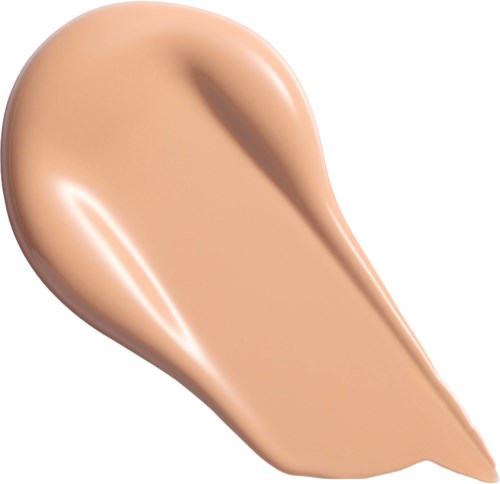 Beige nestemäinen meikkivoide levitetty vesipisaran muotoon kiiltävä ja sileä pinta.