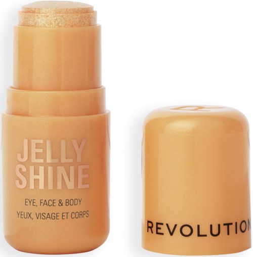 Een perzikkleurige container en deksel, gelabeld 'Jelly Shine' voor gezicht, ogen en lichaam, door Revolution.