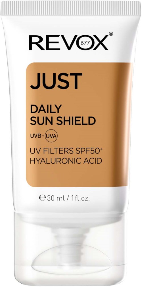 Een zonnebrandcr e8me tube met SPF 50+ en hyaluronzuur, gelabeld Revox Just Daily Sun Shield.
