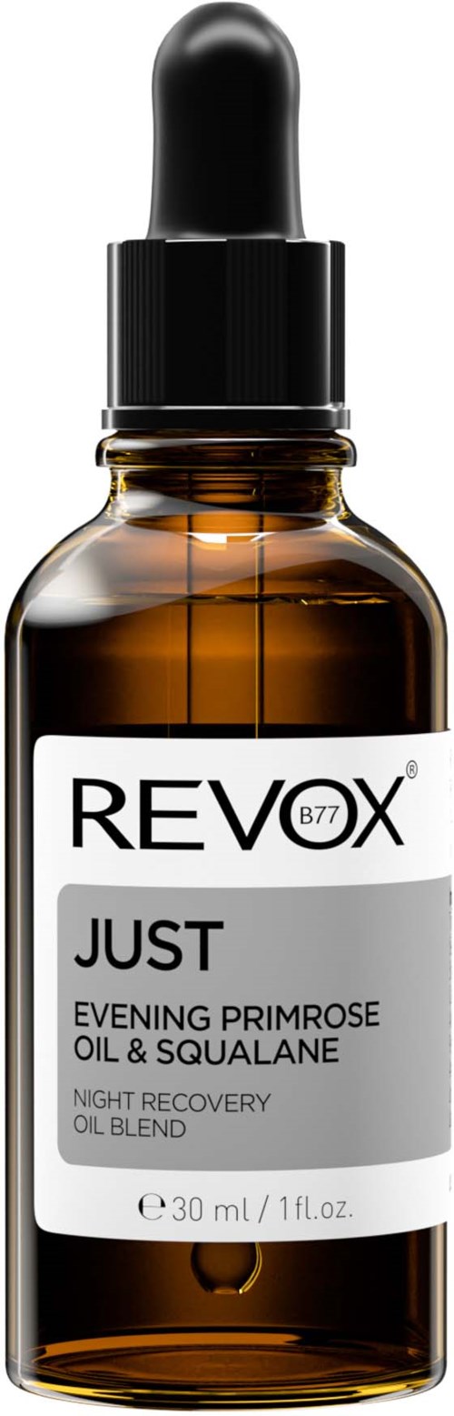 A small brown glass bottle with a black dropper cap, labeled 'REVIX JUST' night oil with evening primrose, oil, and squalane.