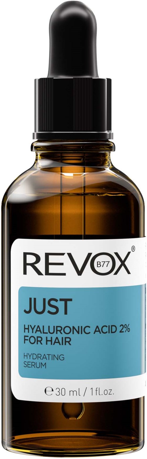 En liten brun glasflaska med svart dropparlock, märkt 'Revox Just Hyaluronic Acid 2% for Hair'.