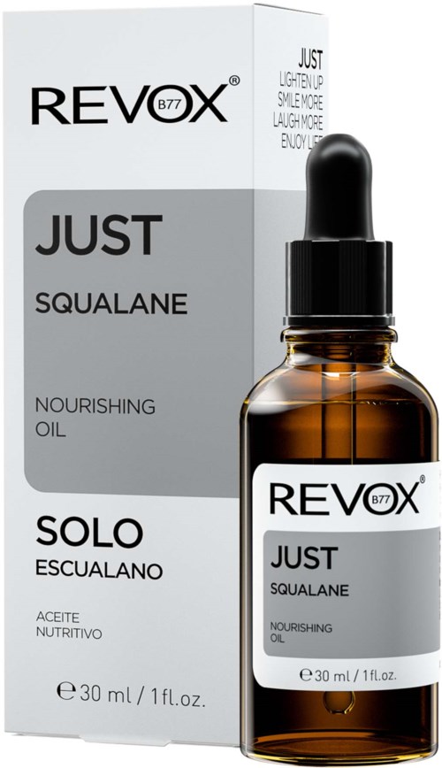 Een doos en fles met Revox B77 Just Squalane voedende olie. De doos is grijs en wit, de fles is bruin met pipet.