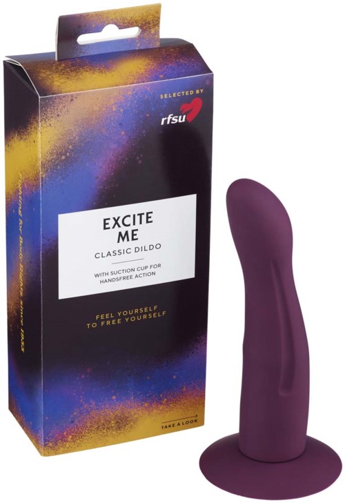 Lila klassischer Dildo mit Saugnapf, neben bunter Verpackung. Die Box zeigt Marken- und Produktinformationen.