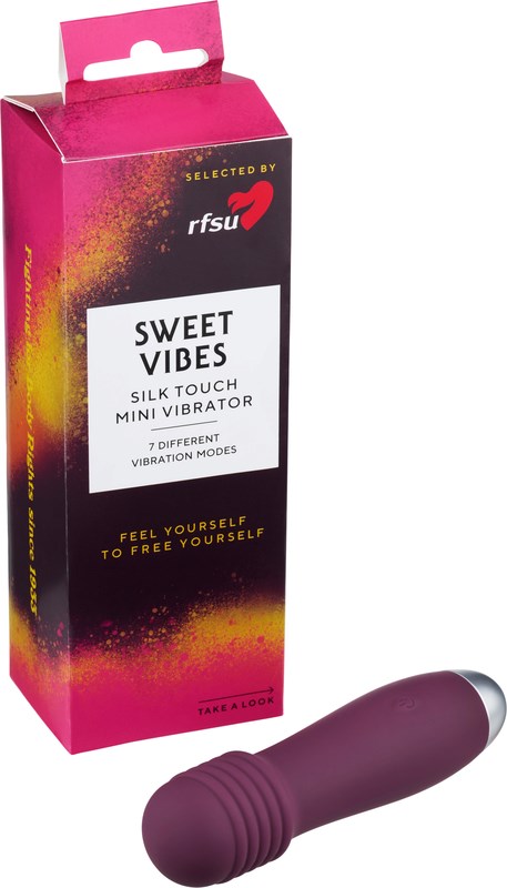 Pink und schwarze Schachtel mit Produktname und Marke, die einen lilafarbenen Mini-Vibrator zeigt.
