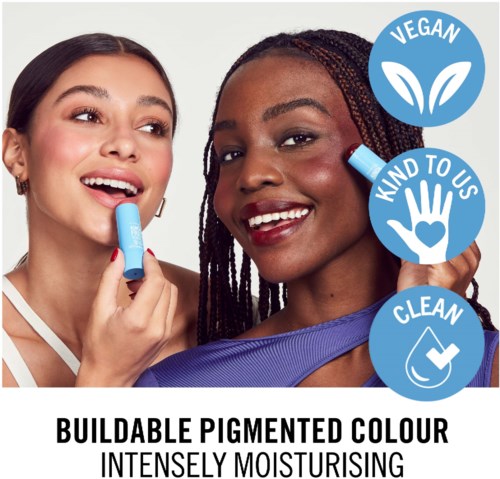 Two women smiling, one using a blue lipstick, with logo icons for vegan, kind to us, and clean. Text about buildable pigment and moisturising.
