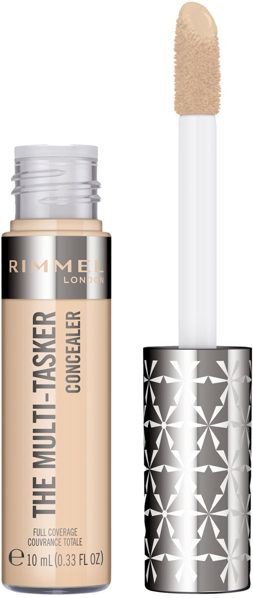 A concealer tube with a brush applicator and metallic silver cap with star patterns.
