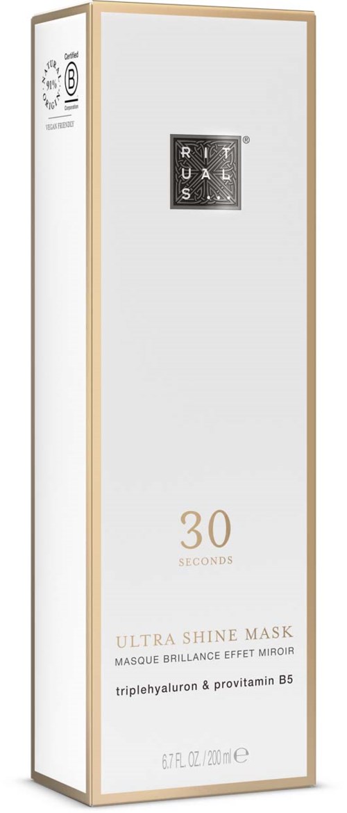 Tall white box with a small black square logo and gold text, showing product details and ingredients.