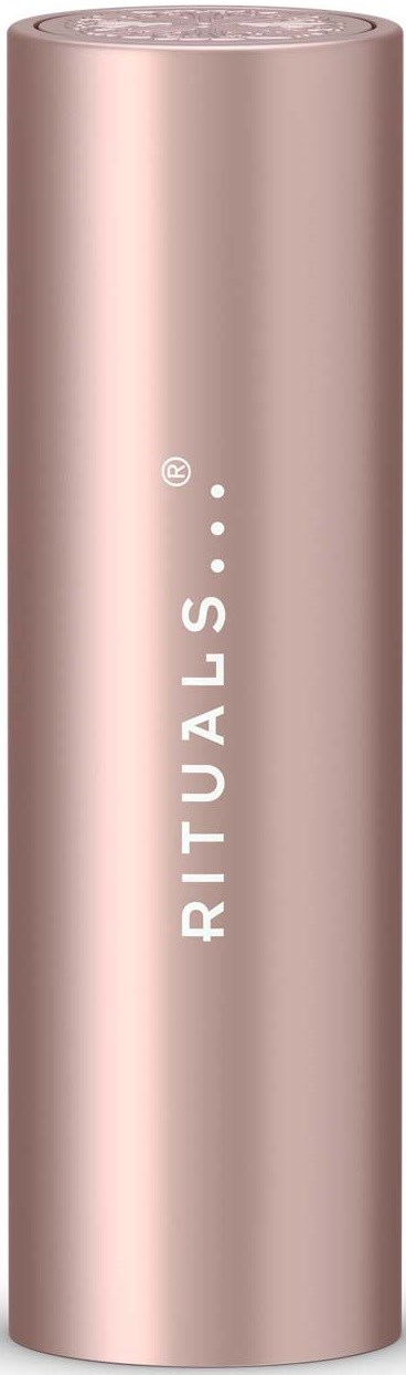 En lång, roseguldig cylindrisk behållare för skönhets- eller hudvårdsprodukter med vitt text som säger Rituals.