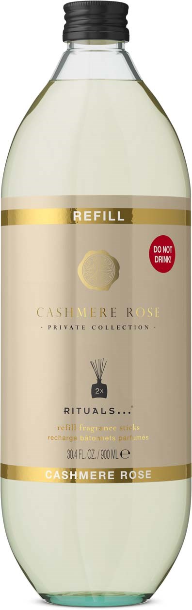 En refillflaske med Cashmere Rose-parfyme fra Rituals, med enkel beige og gullfarget etikett og svart lokk.