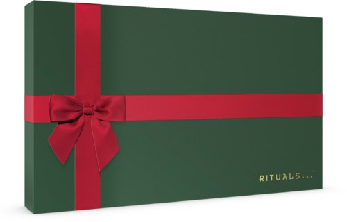 Vihreä laatikko, koristeltu punaisella nauhalla ja ruseteilla, lukee "RITUALS...".