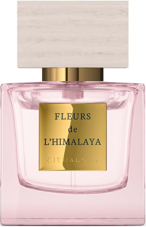 A pink perfume bottle with a whitecap and gold label. The label reads "Fleurs de L'Himalaya Rituals."