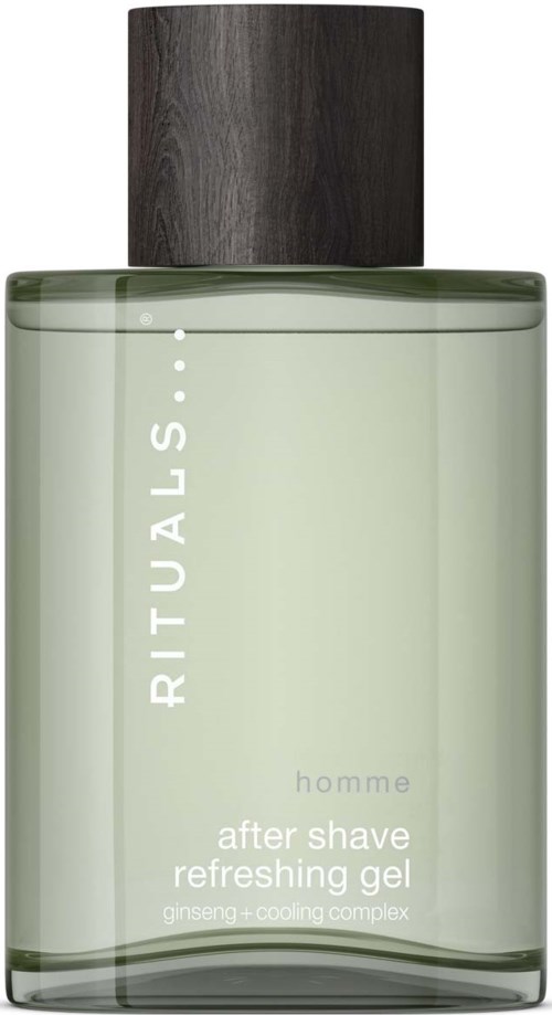 A clear green bottle with a dark wooden cap, labeled 'RITUALS. homme after shave refreshing gel.'