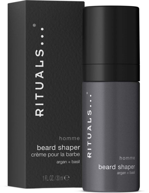 A small gray bottle and a black box beside it. The box says 'RITUALS beard shaper' for men with argan and basil.