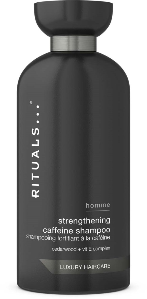 Schwarze Flasche mit silberner Kappe, gekennzeichnet als Koffein-Shampoo für die Haargesundheit zu Hause.