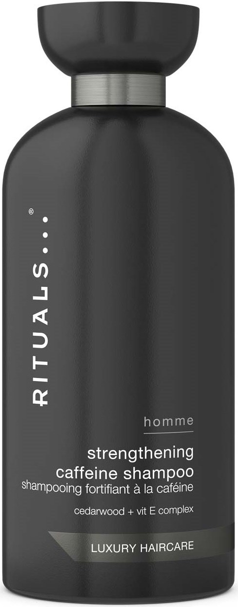 En mørkegrå sjampoflaske med svart topplokk, merket RITUALS homme caffeine styrkende sjampo.