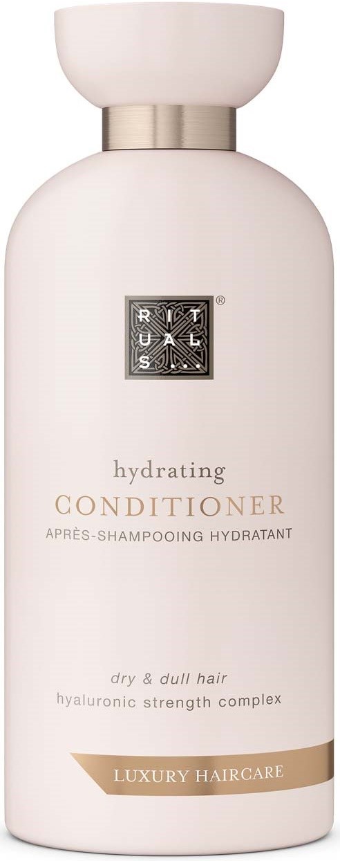 A white bottle labeled RUSK Hydrating Conditioner for dry, dull hair with hyaluronic strength. It says luxury haircare.