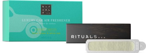A box of luxury car air freshener with a spray, a black card with 'RITUALS...' and a white spray nozzle.