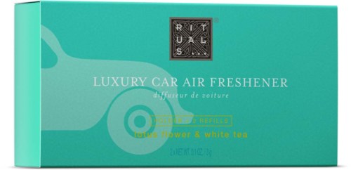 A box of luxury car air freshener with flower and white tea scent, in green color with black and white label.