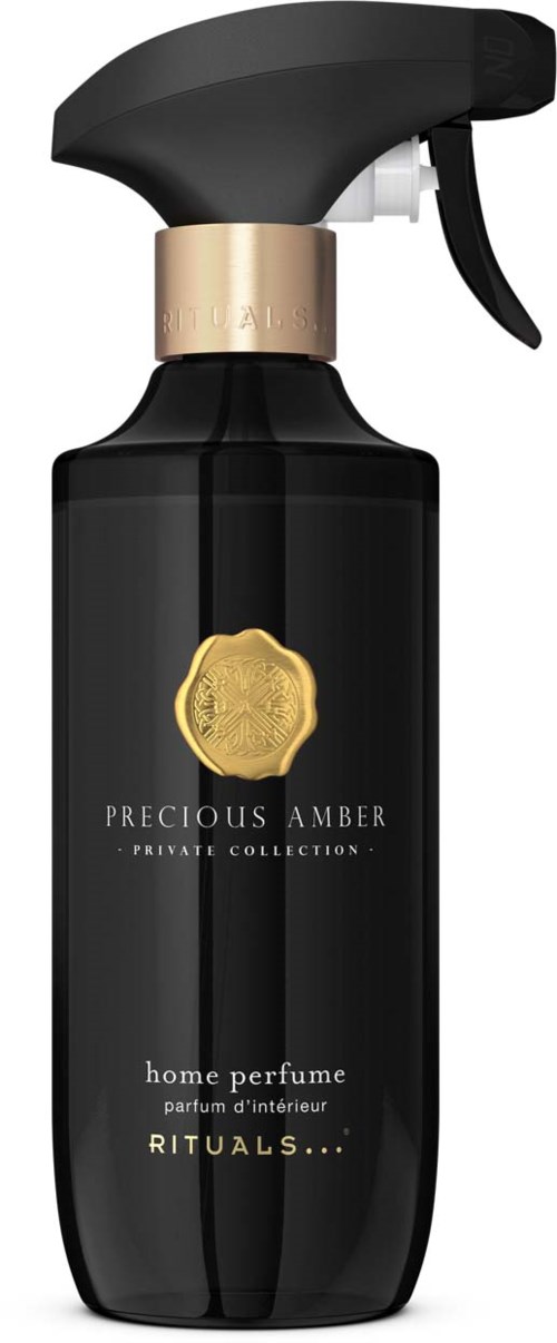 Eine schwarze Sprühflasche mit Goldsiegel, gekennzeichnet mit Precious Amber Heimparfüm von Rituals.