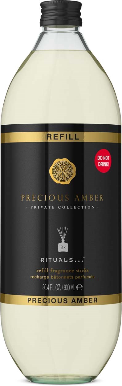 Påfyllingsflaske for Precious Amber duft med svart etikett og gulldetaljer, stor klar beholder med svart lokk.