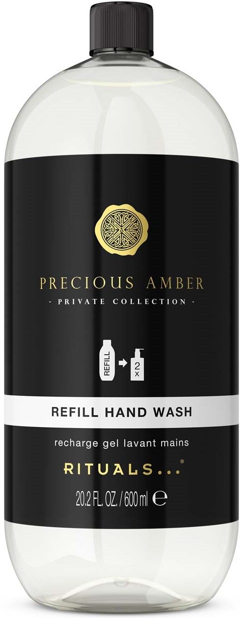 En gjennomsiktig plastflaske med svart etikett og gullmerke, merket Rituals Precious Amber refill håndsåpe med 23 fl oz.