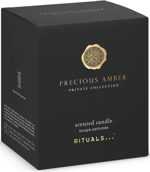 Schwarze Schachtel mit goldenem Emblem und Text für Duftkerze der Precious Amber Kollektion.